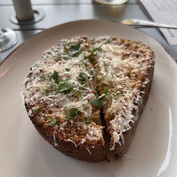 Campana signature dishes Tonnarelli Cacio e PepePollo al Mattone (Chicken Under a Brick)Wood-Fired Focaccia